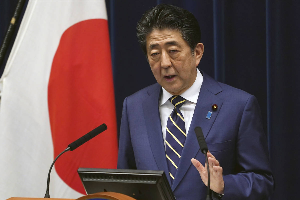 Japanese Prime Minister Shinzo Abe delivers his speech about the coronavirus situation in Japan ...