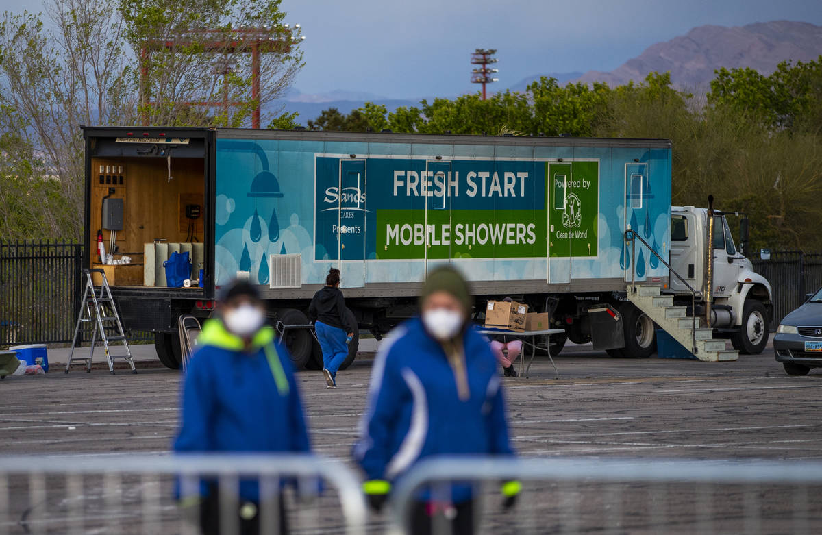 No showers yet but washing is available for the homeless at the temporary shelter in the upper ...