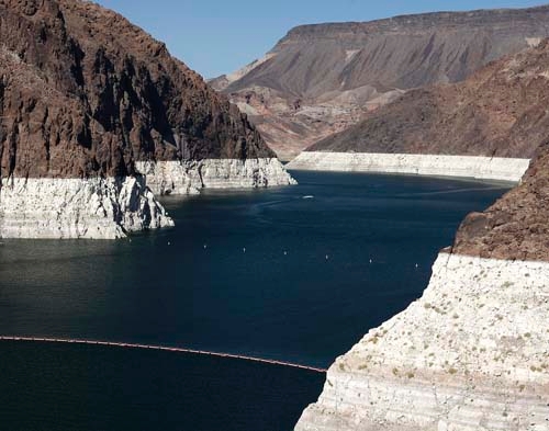 The bleached ring around the canyon just above Hoover Dam shows the water levels of Lake Mead in September, 2008. According to the latest projections from federal forecasters, the reservoir east o ...