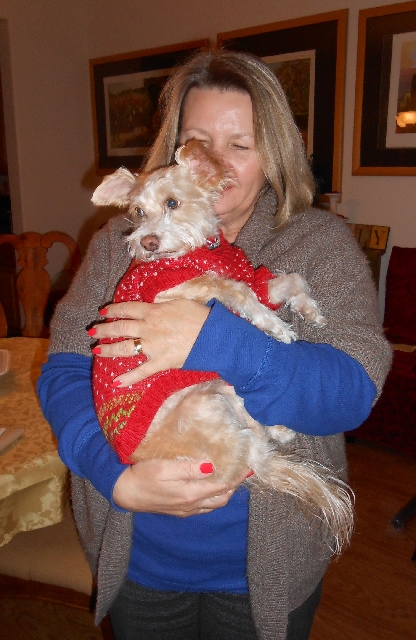 Gabriele Pruitt holds her dog Stacy Jan. 15 at her home near Lone Mountain. Stacy, a rescue terrier mix, had gone missing a year ago and was reunited with the family after a mix-up at the groomer& ...