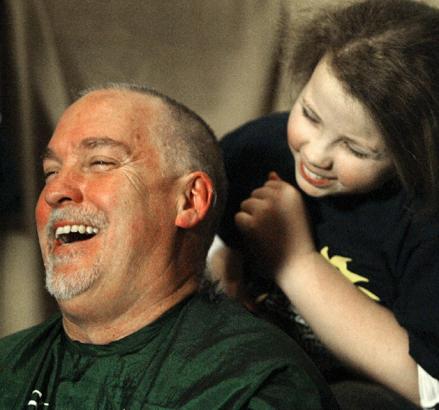 Las Vegas Review-Journal columnist John L. Smith and daughter Amelia share a laugh after she shaved his head during the 2011 McMullan’s St. Baldrick’s Day celebration. This year’ ...