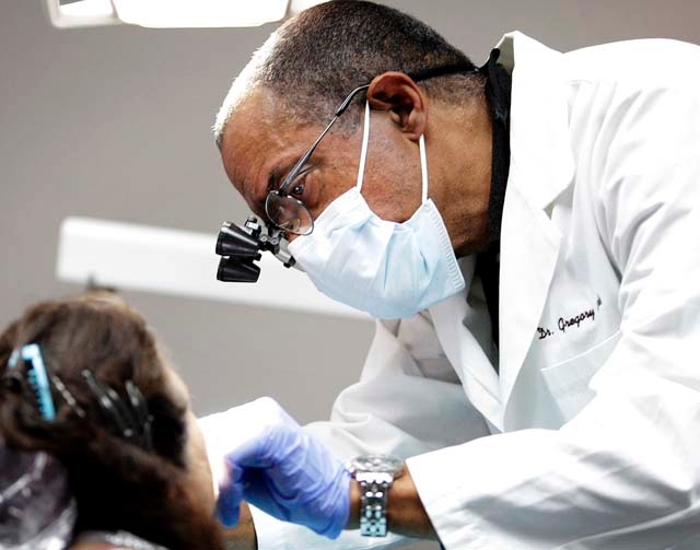 AfricanAmerican Las Vegas dentist thrives with personal touch Las