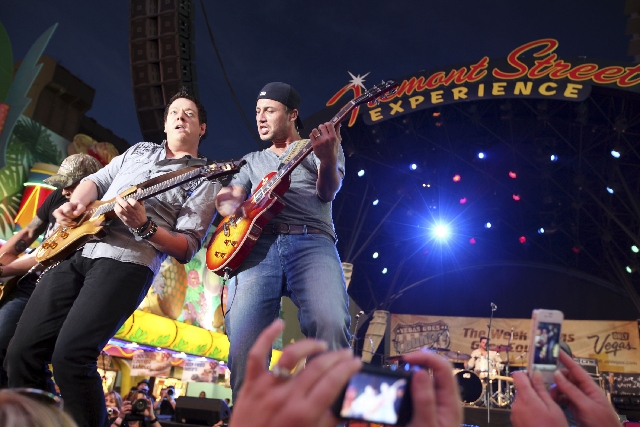 Eric Gunderson and Stephen Barker Liles of the country music band Love and Theft perform at the ACM Fremont Street Experience in 2012. This year, Love and Theft are scheduled to play outdoors at T ...