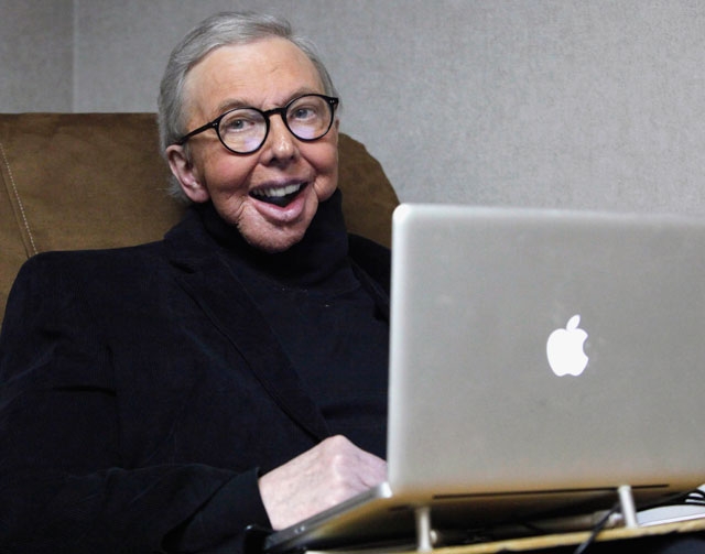 In this Jan. 12, 2011, file photo, Pulitzer Prize-winning movie critic Roger Ebert works in his office at the WTTW-TV studios in Chicago. The Chicago Sun-Times is reporting that its film critic Ro ...