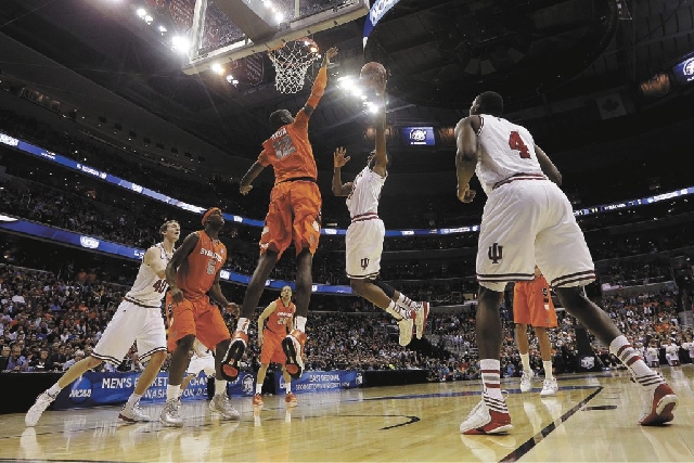 Syracuse defends against Indiana during the first half of an East Regional semifinal in the NCAA tournament, Thursday, March 28 in Washington.