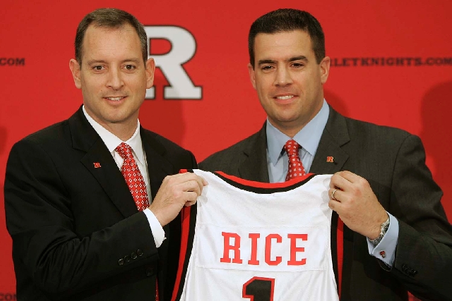 In this May 6, 2010, file photo, Rutgers University Athletic Director Tim Pernetti, right, presents Mike Rice with a jersey after being introduced as the new men’s head basketball coach at R ...
