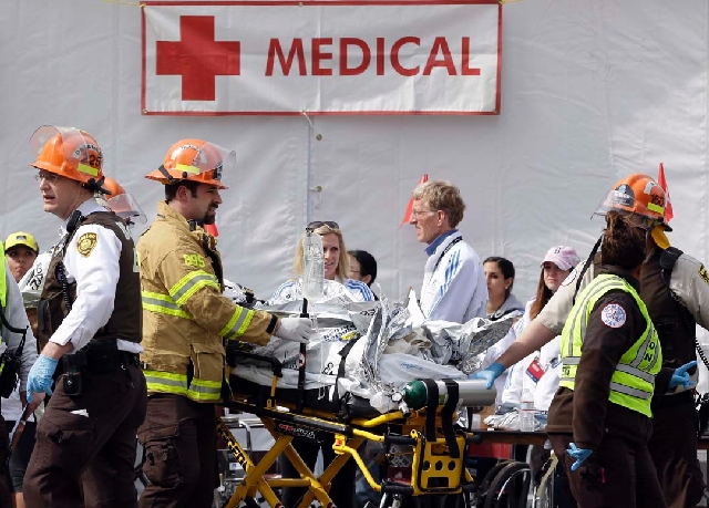 Medical personnel work outside the medical tent in the aftermath of two blasts which exploded near the finish line of the Boston Marathon in Boston on Monday.