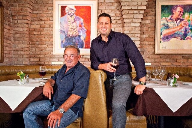 Freddie, left, and Evan Glusman relax in their restaurant, Piero's Italian Cuisine.