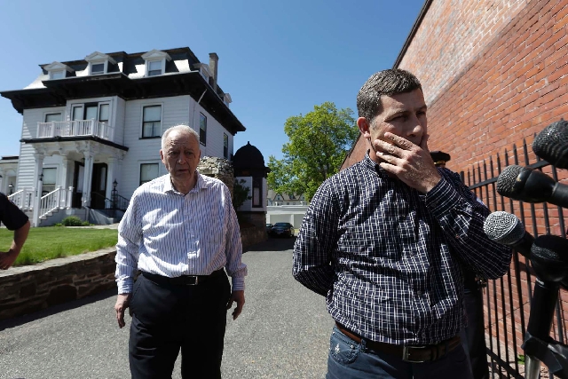 Ruslan Tsarni, right, uncle of killed Boston Marathon bombing suspect Tamerlan Tsarnaev, prepares to speak with reporters in front of the Graham, Putnam, and Mahoney Funeral Parlors, in Worcester, ...