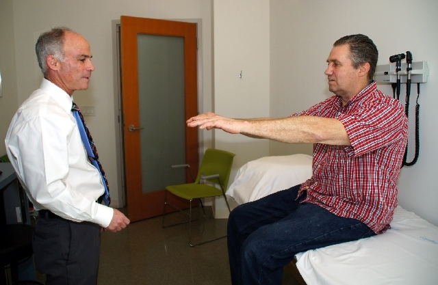 Dr. Charles Bernick, left, at the Cleveland Clinic's Lou Ruvo Center for Brain Health, works with former boxer Albert Yasbick. Bernick heads the Professional Fighters Brain Health Study. Yasbick s ...
