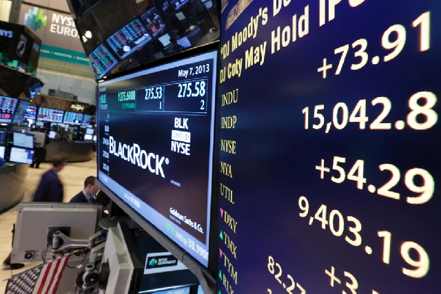 A board on a trading post on the floor of the New York Stock Exchange shows the Dow Jones industrial average with an intraday number above 15,000 on Tuesday. The U.S. stock market joined a global ...