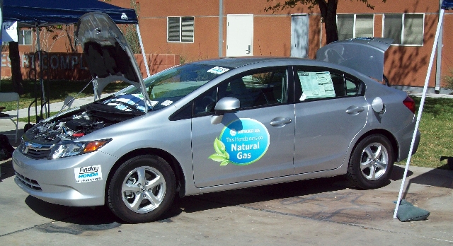 The Honda Civic CNG uses compressed natural gas instead of gasoline to fuel its internal combustion engine.