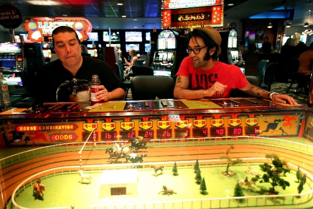 Brian Simpson, left, and Eli Williams, both of Vancouver, British Columbia, play the Sigma Derby game at the D Las Vegas on May 13. After $22 million in renovations, the former Fitzgeralds in down ...