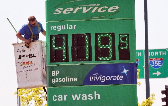 A service person works on sign at BP station at 35E and County Road E in Vadnais Heights, Minn. on Tuesday. Gas prices in the Twin cities have exceeded the $4.00 per gallon mark.