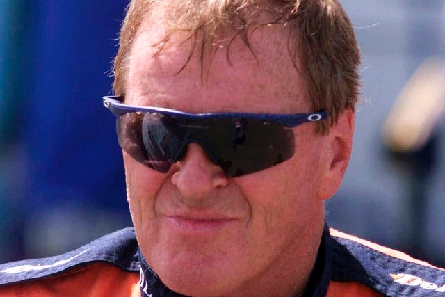 In this June 4, 1999, file photo, NASCAR driver Dick Trickle speaks to fans after qualifying on the pole position the NASCAR Busch series auto race at Dover Downs in Dover, Del. Authorities in Nor ...