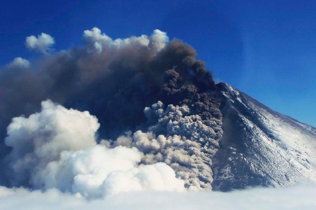 In this photo provided by the Alaskan Volcano Observatory, the Pavlof volcano erupts Friday , as seen from the air near Cold Bay, Alaska.