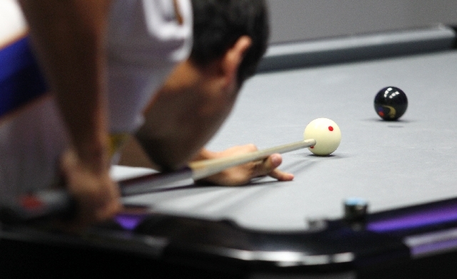 Las Vegas' Charlie Williams lines up a shot against Toronto during a World Professional Billiard League game at the WPBL Arena, 6745 Surrey St., in Las Vegas on Sunday.