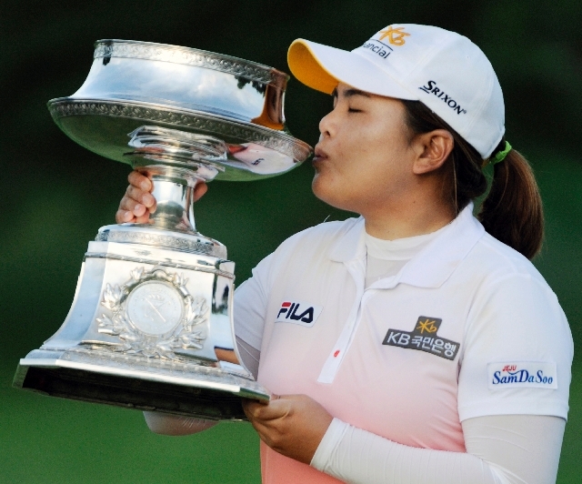 Top-ranked LPGA golfer Inbee Park kisses the trophy after winning the LPGA Championship in Pittsford, N.Y., on June 9. Park, a Bishop Gorman High product, has hit her career stride this season wit ...