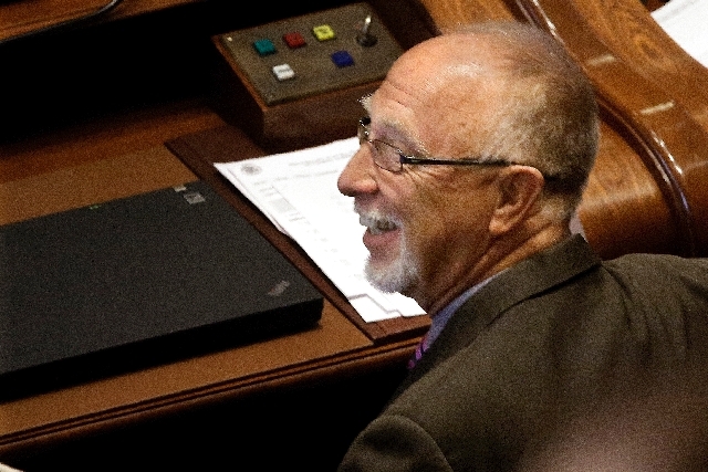 Illinois Sen. Gary Forby, D-Benton, smiles as concealed carry gun legislation passes while on the Senate floor during session at the Illinois State Capitol Tuesday in Springfield, Ill.
