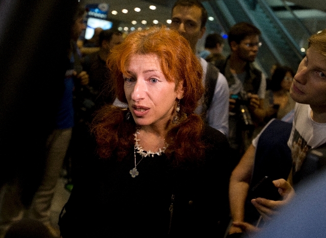 Deputy head of the Russian office of Human Rights Watch, Tatiana Lokshina, speaks to the media at Sheremetyevo airport outside Moscow, Russia, Friday.