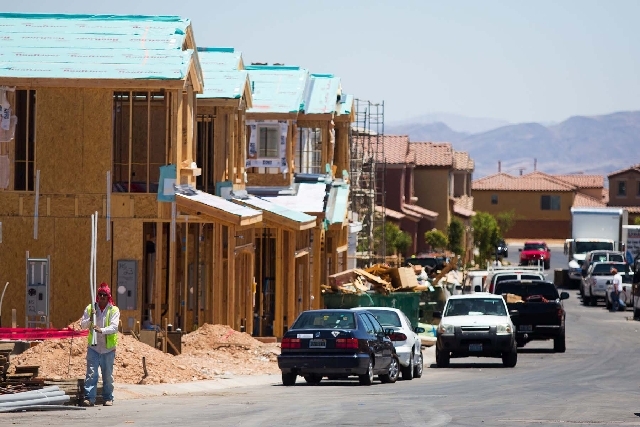 News houses are constructed by builder Lennar Homes in the Mountains Edge subdivision Monday, June 17, 2013. The National Association of Home Builders/Wells Fargo builder sentiment index released  ...