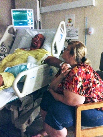 Daniel Sanders lies in a bed at Valley Hospital Medical Center, 620 Shadow Lane, in June while his wife, Charlotte, sits at his side. Sanders, a northwest Las Vegas resident, benefited from having ...
