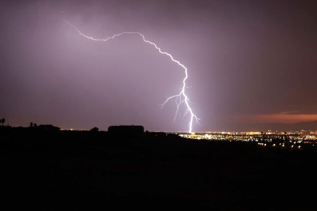 Lighting strikes during a powerful thunderstorm that rolled through Las Vegas on Friday night. This photo was taken from Henderson looking toward the Las Vegas Strip.