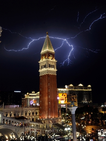 Lightning strikes over the Las Vegas Strip during storms on Friday night. High winds, rain and flash flash flooding struck the valley as the storm rolled through from the northeast.