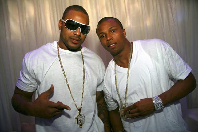 In this May 2007 photo, NFL player Larry Johnson stands with NBA player Sebastian Telfair at Pure nightclub inside Caesars Palace hotel-casino. On Tuesday, Johnson, 33, appeared in Las Vegas Justi ...