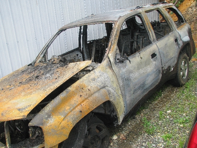 A burned out vehicle is shown near Oak Ridge, Tenn. Tennessee Titans linebacker Jonathan Willard says he helped rescue a family from a burning vehicle on his way to NFL football training camp on T ...