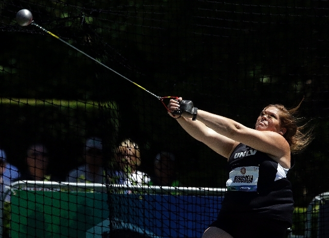 File- Amanda Bingson competes at the women's hammer throw qualifying round at the U.S. Olympic Track and Field Trials Thursday, June 21, 2012, in Beaverton, Ore.