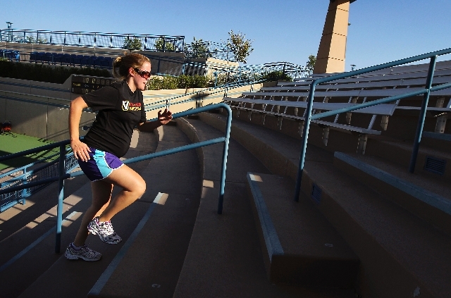 Vanessa Baur, who is 28 weeks pregnant, runs stairs in the summer heat during a private workout session with Las Vegas Bootcamp at the Darling Tennis Center in Las Vegas.