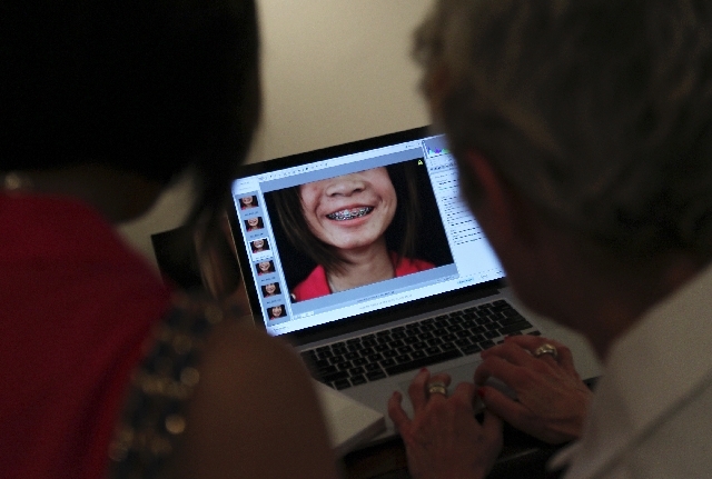 Artist Abby Robinson, right, shows Brittany Du the photo she took of her for the project entitled "Body Imaging" at the P3 Studio in the Cosmopolitan in Las Vegas on Aug. 9.