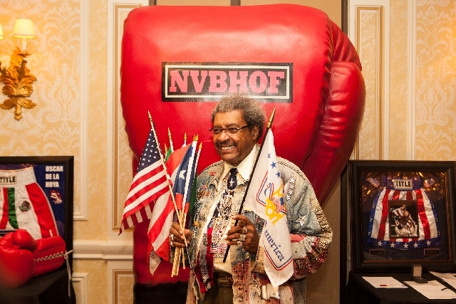 Don King, shown Saturday holding flags representing the countries where he promoted fights, was one of 19 inductees in the inaugural class of the Nevada Boxing Hall of Fame.