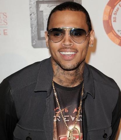 In this  July 15 file photo, Chris Brown arrives at the 8th Annual Bear Trap Entertainment All-Star Celebrity Kickoff Party at the Playboy Mansion in Los Angeles. Brown was sued Tuesday by Sha-kei ...