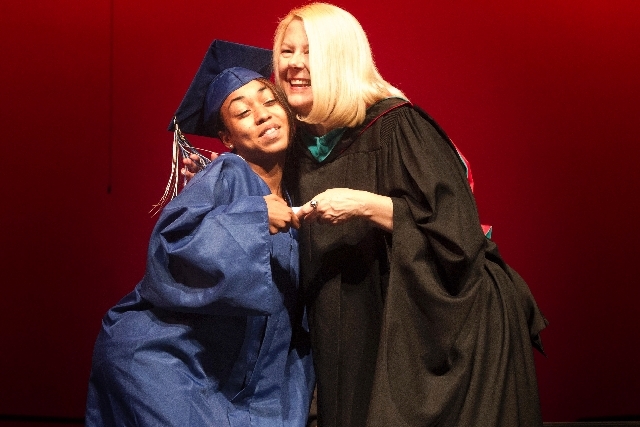 Desert Pines High School student  Breanna Rodriguez hugs Clark County School Board member Lorraine Alderman after receiving her high school diploma at the  Theater of the Las Vegas Academy of Inte ...