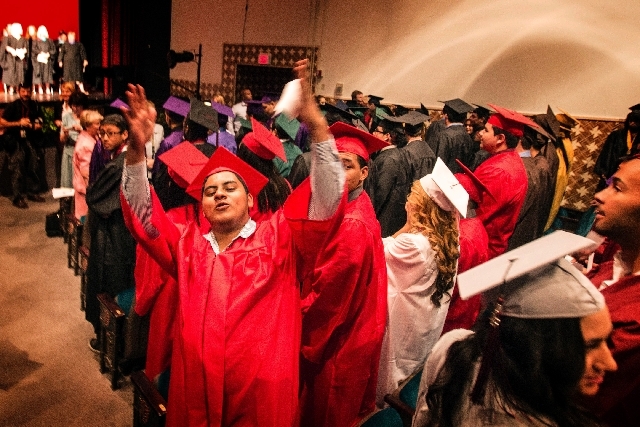 Valley High School student Christopher Parra, acknowledges family and friends during autumn graduation at  the Theater of the Las Vegas Academy of International Studies, Performing and Visual Arts ...