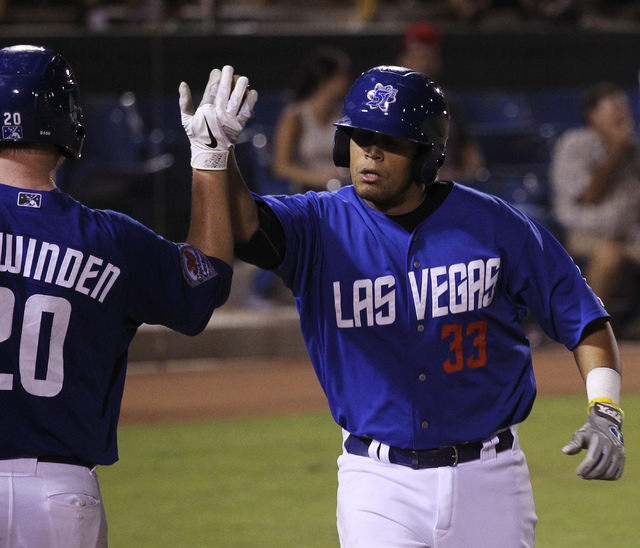 The 51s Francisco Pena (33) gets congratulated after hitting a home run in the fourth inning against Tucson at Cashman Field in Las Vegas on Aug. 31, 2013. (Jason Bean/Las Vegas Review-Journal)