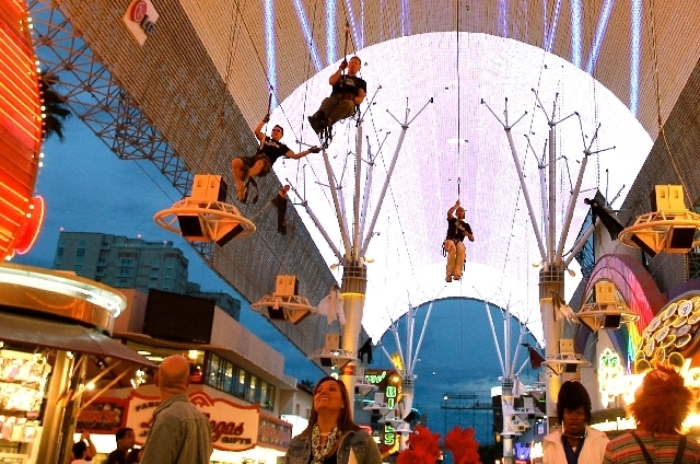 Thrill seekers take a ride on the Fremont Street Flightline attraction under the Fremont Street Experience canopy.