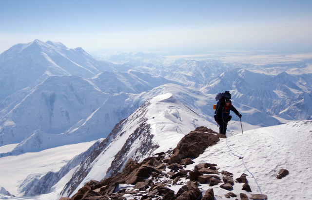 FILE - In this May 9, 2013 file photo released by the Alaska Air National Guard, Chief Master Sgt. Paul Barendregt climbs up the prow of the West Buttress on Mount McKinley conducting winter rescu ...