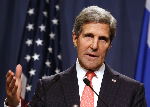 U.S. Secretary of State John Kerry answers questions during a joint media conference with Russian Foreign Minister Sergei Lavrov, not pictured, following meetings regarding Syria, at a news confer ...