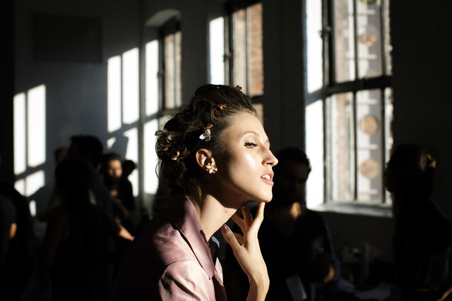Anna Cleveland, of the Netherlands, poses for a photograph backstage before the Zac Posen Spring 2014 collection is modeled during Fashion Week in New York, Sunday, Sept. 8. (AP Photo/John Minchillo)