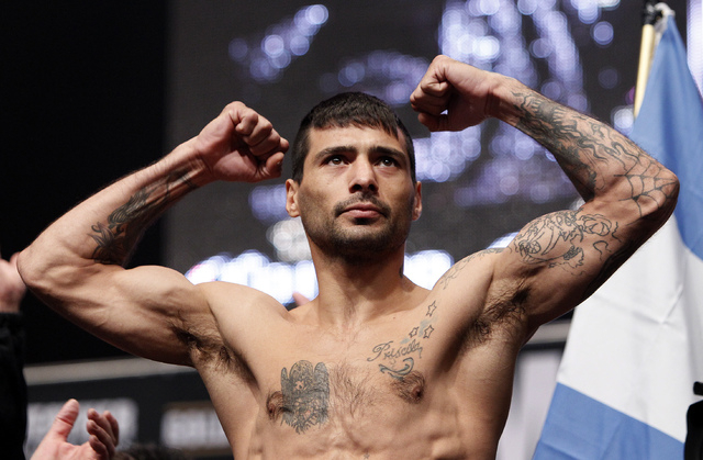 Lucas Matthysse poses during a weigh in at the MGM Grand in Las Vegas Friday, Sept. 13, 2013. Matthysse will fight Danny Garcia Saturday in a super lightweight title bout at the MGM Grand. (John L ...