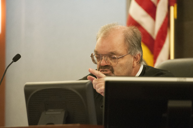 Judge Conrad Hafen is seen addressing David Allen Brutsche in the courtroom for his preliminary hearing at the Regional Justice Center, Thursday, Sept. 26, 2013, in Las Vegas, Nev. Brutsche faces  ...