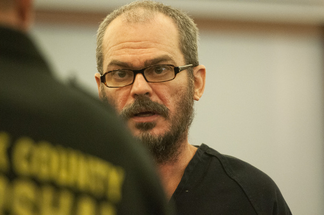 David Allen Brutsche stands in the courtroom for his preliminary hearing at the Regional Justice Center, Thursday, Sept. 26, 2013, in Las Vegas, Nev. Brutsche faces charges for conspiracy to commi ...
