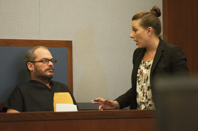 David Allen Brutsche, left, is seen in the courtroom for his preliminary hearing at the Regional Justice Center, Thursday, Sept. 26, 2013, in Las Vegas, Nev. Brutsche faces charges for conspiracy  ...