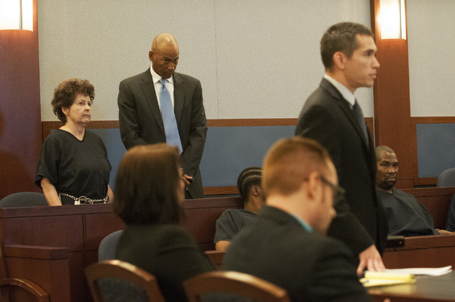 Devon Campbell Newman, left, stands in the courtroom for her preliminary hearing at the Regional Justice Center, Thursday, Sept. 26, 2013, in Las Vegas, Nev. Newman faces charges for conspiracy to ...