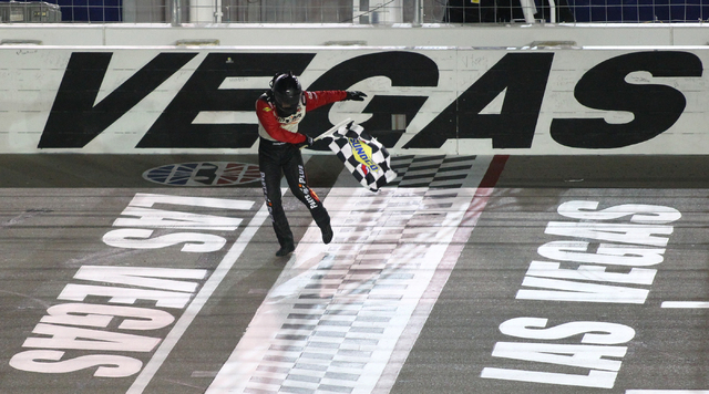 Timothy Peters celebrates his win at the finish line of the Smith's 350 NASCAR Camping World Truck Series at the Las Vegas Motor Speedway on Saturday, Sept. 28, 2013. (Chase Stevens/Las Vegas Revi ...