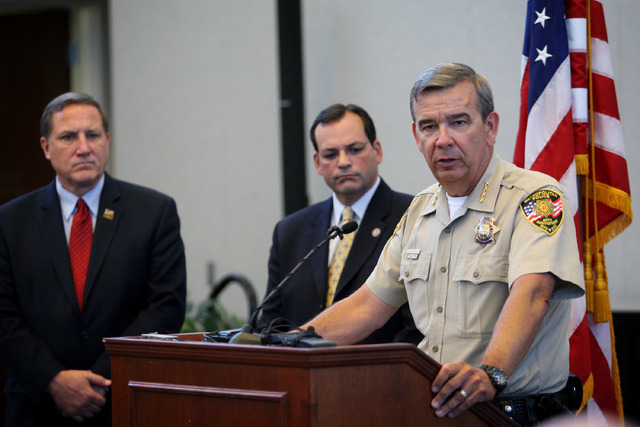 Clark County Sheriff Doug Gillespie, right, speaks at a press conference discussing a six-month Department of Justice review of the Las Vegas Metropolitan Police Department's use of force policies ...