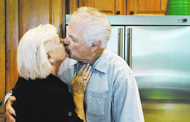 Harvey Levy kisses his wife Jane in the kitchen of their home near Eastern Avenue and Reunion Drive in Henderson on Monday, Aug. 26, 2013. Harvey, who has Alzheimer's disease, recently participate ...